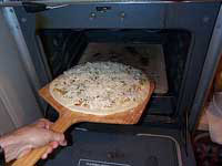 pizza into oven